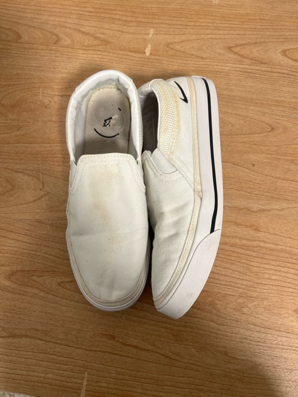 Nike White Slip-On Sneakers with Black Swoosh Detail